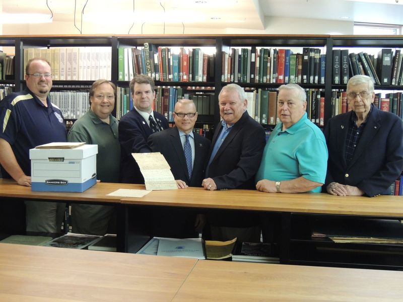 Delaware Society of the Sons of the American Revolution members join Delaware Public Archives Director Stephen M. Marz for the donation of the DESSAR membership applications. Shown (l-r) are Troy Foxwell, first vice president; George Contant, member; Michael Keen, historian; Marz; George Jones, president; George Locke, secretary; and Jack Lewis, past president. SOURCE SUBMITTED